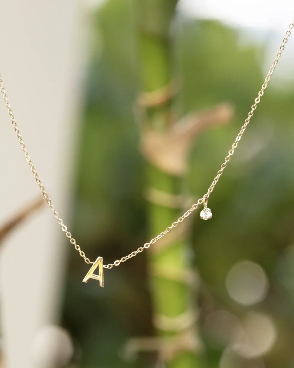 14k gold initial necklace with small side diamond dangle