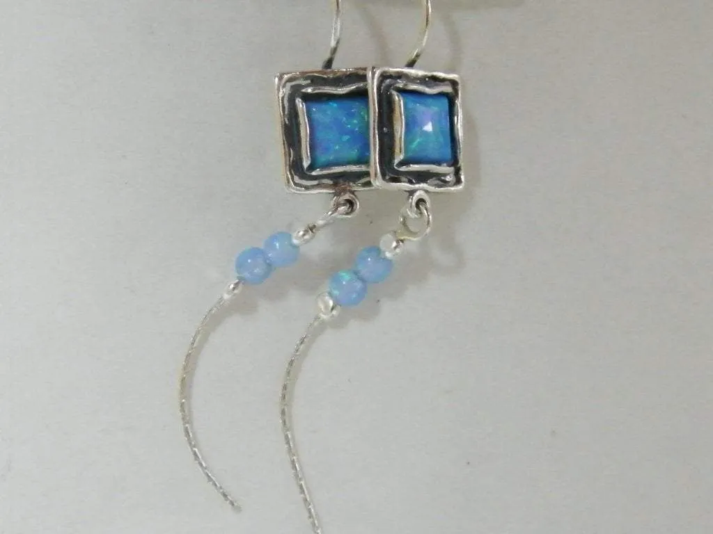 Bluenoemi Israel Jewelry Sterling Silver Earrings for Woman set with blue lab opals.