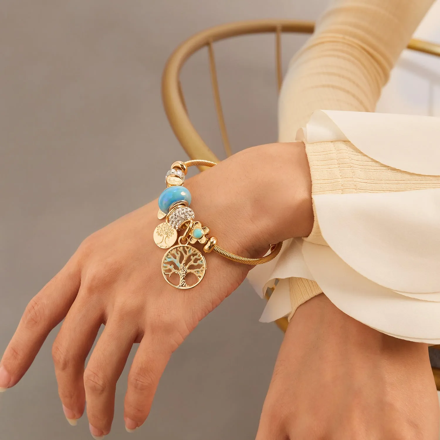 Gold Charm Bracelet for Women with Blue Beads and Tree of Life Charms - Elegant and Stylish Jewelry for Any Occasion